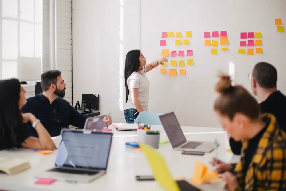 A team mapping priorities on sticky notes