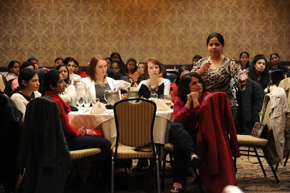 A facilitator leading a workshop for a large group